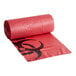 A roll of red biohazard bags with a black symbol on them.