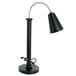 An Eastern Tabletop black countertop heat lamp with a metal pole.