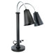 An Eastern Tabletop black double arm heat lamp with metal shades.