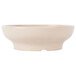 A beige speckled melamine bowl.