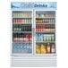 A Turbo Air white two glass door refrigerator full of drinks and beverages.