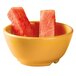 A bowl of watermelon slices in a yellow GET Diamond Mardi Gras melamine bowl.