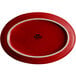 a red plate with a white rim