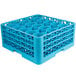 A blue plastic Carlisle glass rack with holes.