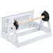 A white metal Bulman Miler food wrap film dispenser with black wheels.