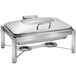 An Eastern Tabletop rectangular stainless steel chafer with a hinged glass dome lid on a stand.