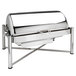 A silver stainless steel rectangular roll top chafer sitting on a counter.