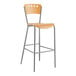 A Lancaster Table & Seating natural finish wooden bar stool with a metal frame.