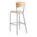 A Lancaster Table & Seating restaurant bar stool with a wooden seat and metal frame.