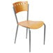 A Lancaster Table & Seating natural finish cafe chair with metal legs.