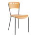 A Lancaster Table & Seating natural finish wooden cafe chair with metal legs.