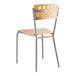 A Lancaster Table & Seating wooden cafe chair with metal frame.
