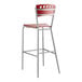 A red and silver Lancaster Table & Seating mahogany finish cafe bar stool with a backrest.