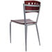 A Lancaster Table & Seating mahogany finish cafe chair with a metal frame and legs.