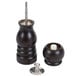 A black wooden pepper mill and salt shaker combo with metal accents.