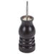 A black wooden Chef Specialties pepper mill with a metal handle and knob on a counter.