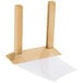 A Menu Solutions natural wood table tent on a wooden stand with two legs.