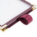 A Menu Solutions burgundy sewn edge table tent with two views on a white background.