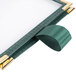 A close-up of a green fabric Menu Solutions table tent with sewn edges.