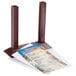 A mahogany wood Menu Solutions table tent on a table holding a menu.