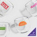A case of 24 customizable stemless wine glasses with different colored logos.