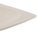 A matte sandstone oval platter with a hole in the middle.