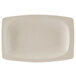 A white oval platter with a speckled surface.