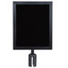 A black square sign frame on a metal pole.