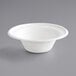 A white EcoChoice Compostable Sugarcane bowl on a gray surface.