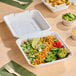 A white, square, compostable take-out box made from plant fiber with one compartment.