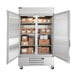 A Beverage-Air reach-in refrigerator with boxes inside.