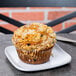 A muffin on a white square coupe plate.