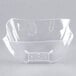 A clear plastic bowl with a wave pattern on a white background.