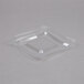 A clear plastic square lid on a clear plastic bowl.