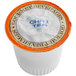 A white container of Caffe de Aroma Authentic Chai Tea Single Serve cups with an orange and black label.