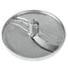 A silver circular Vollrath slicing plate with a hole in the center.