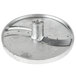 A silver metal circular object with a hole in the center.