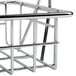 A Vollrath metal grill basket with a handle.