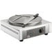 A Carnival King crepe maker with a knife on a circular surface.
