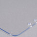 A clear plastic sheet with holes on it.