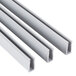 A close-up of a white metal profile with three white plastic strips.