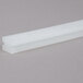 A white rectangular seal pad with holes.