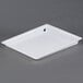A white plastic tray with holes.