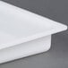 A white plastic Paragon ice tray with a lid.