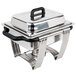 A Vollrath stainless steel rectangular chafing dish with a lid on a table.