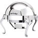 A silver stainless steel round roll top chafer with brass accents on legs.