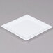 A WNA Comet white square plastic plate with a white rim on a gray surface.