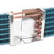 An Avantco evaporator coil, a metal box with copper pipes.