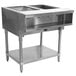 A stainless steel Advance Tabco wetbath hot food table with a shelf.