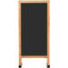 An Aarco oak A-frame sign board with a black chalk board.